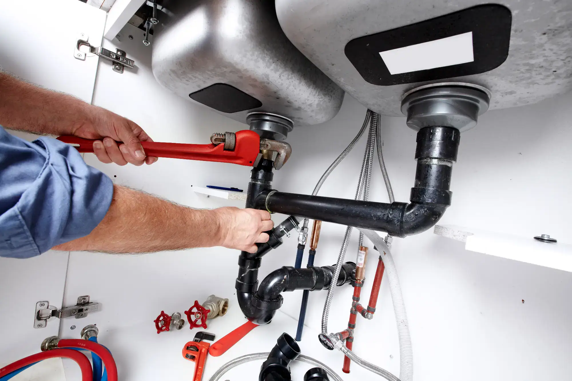 A man is fixing an air conditioner.