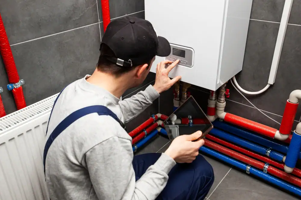 Super Plumbing Heating technician carefully inspecting a boiler in Bergen County, NJ, ensuring optimal performance and safety for the client's home heating system